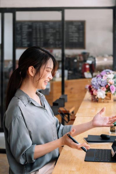 woman talking to laptop